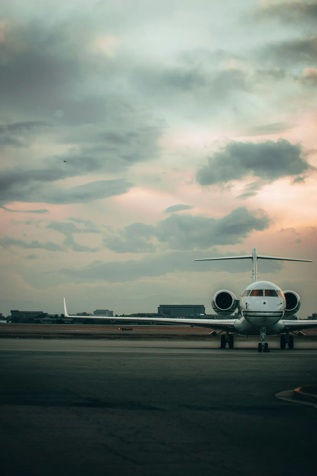 Business jet on a wet ramp at dusk
